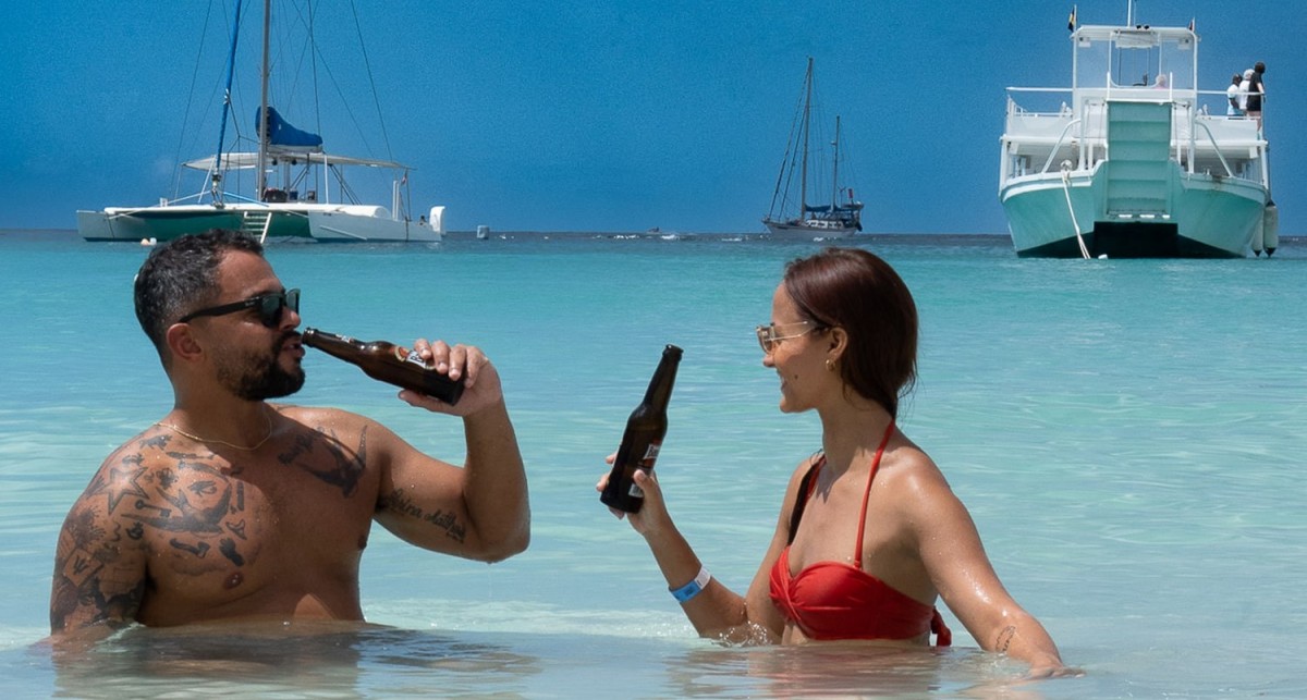 two people enjoying the beach and clear water in Barbados